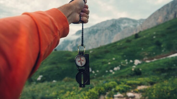 Tourist With Compass In Mountains (1)